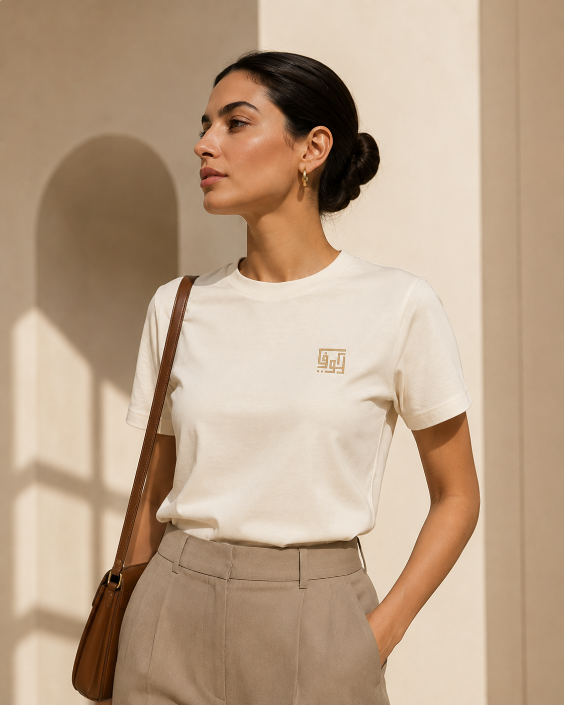 The Art of Kufic Classic Tee collection featuring soft everyday t-shirts styled on a warm neutral background with natural light.